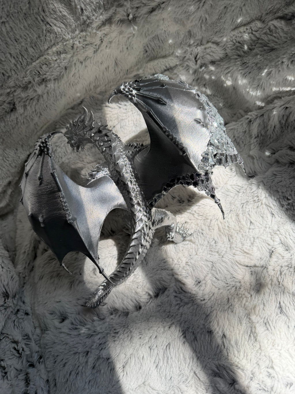 Mirrored Dragon top view showing spread wings and chrome silver finish