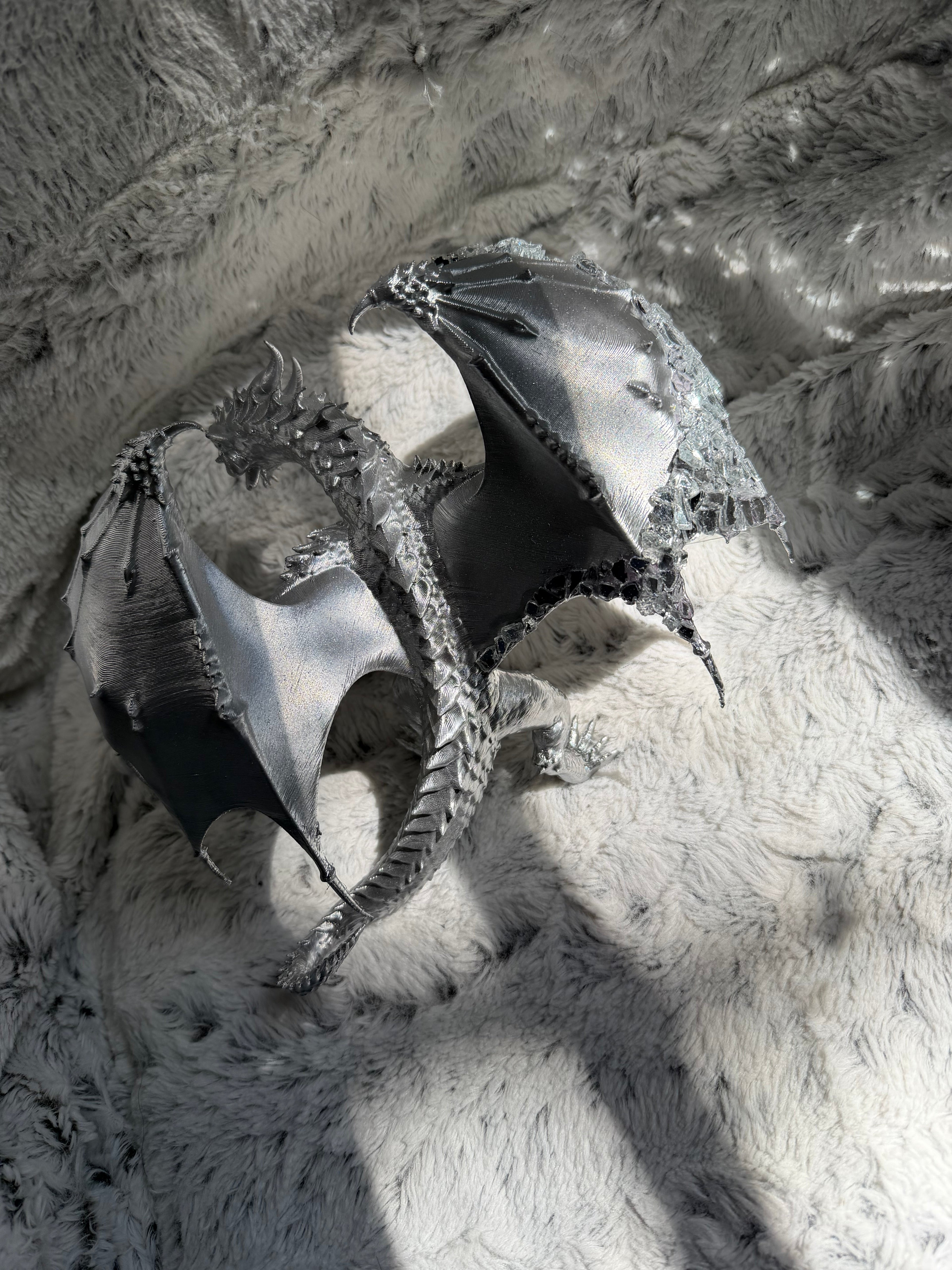 Mirrored Dragon top view showing spread wings and chrome silver finish