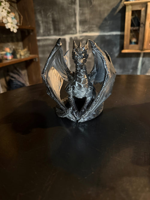 Nightfall Dragon seated pose showing spread wings and deep black metallic finish